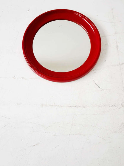 Round mirror with red lacquered frame