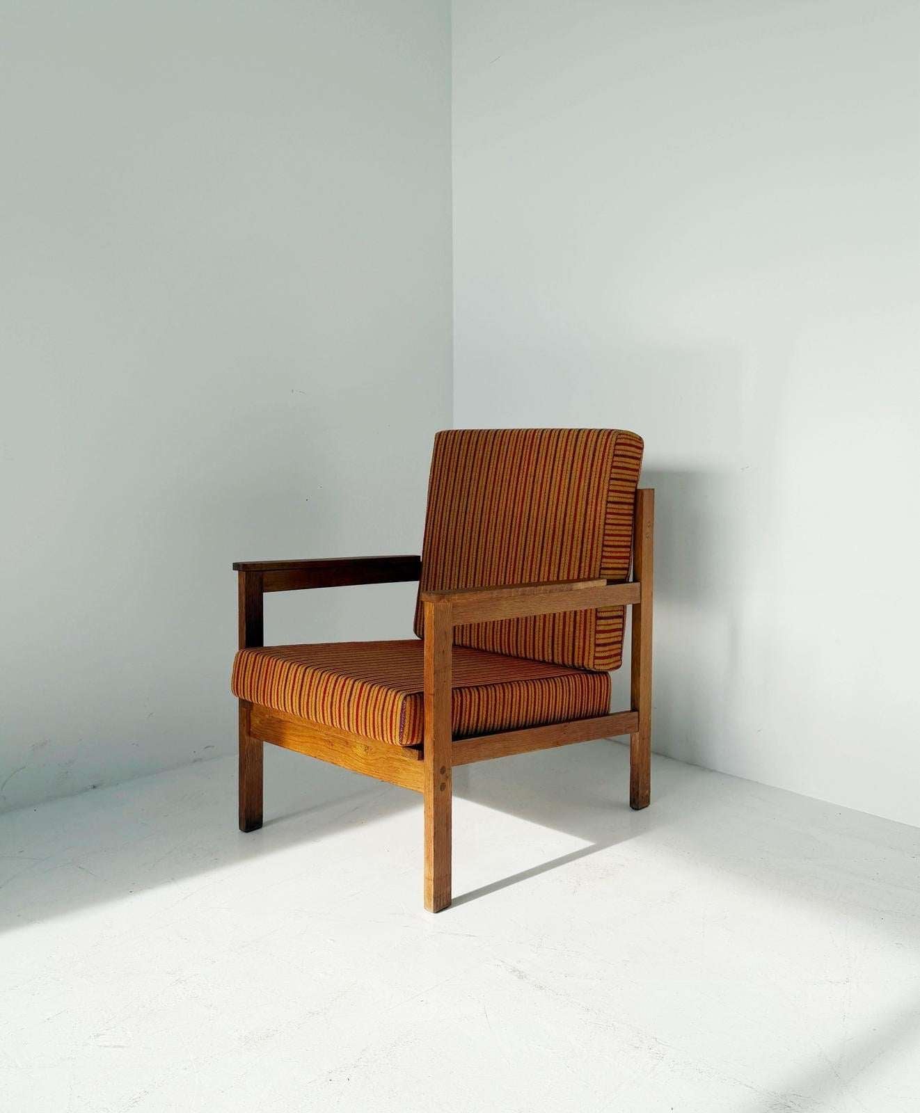 Solid wood armchair with striped upholstery