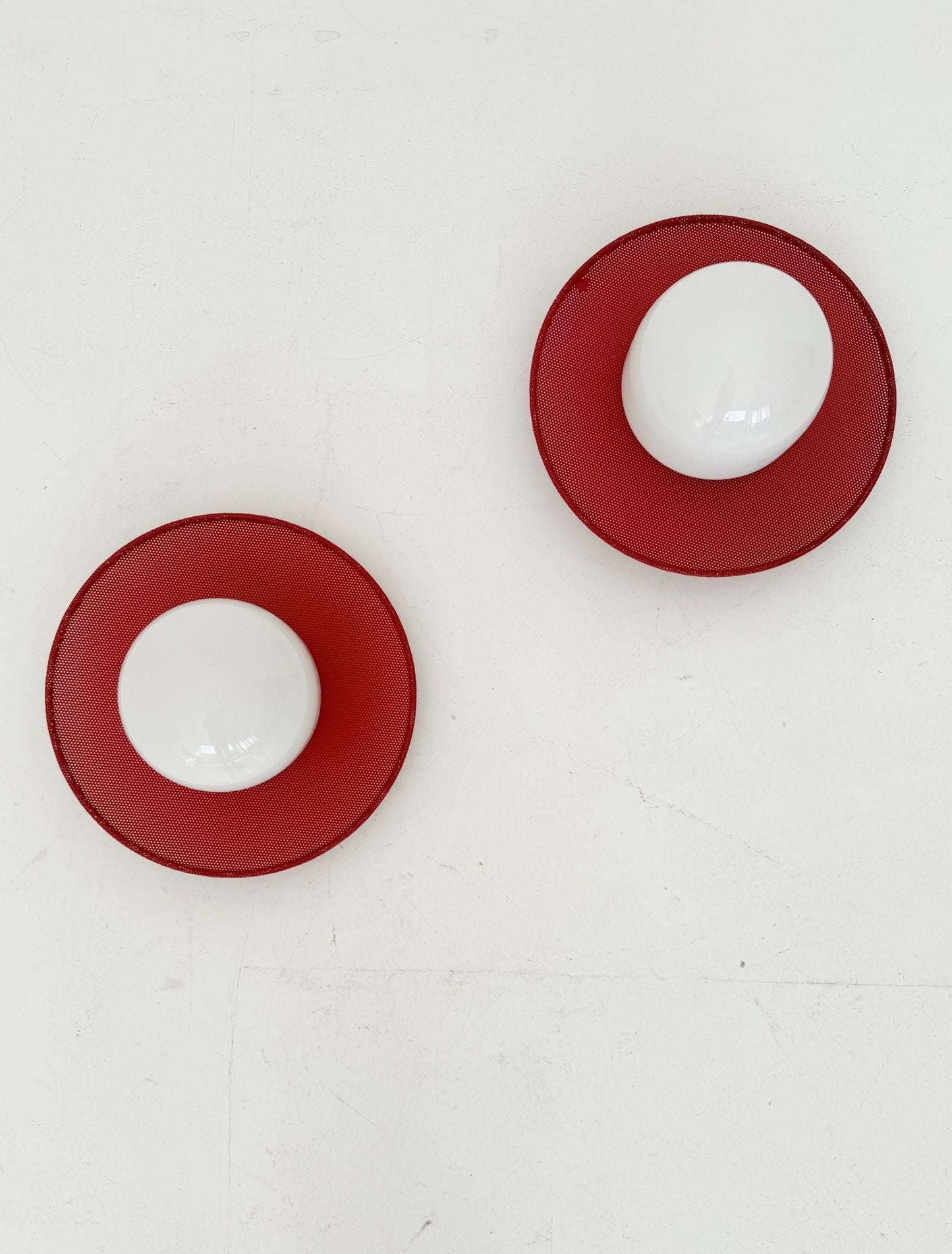 Circular wall lights in micro-perforated metal and opal glass