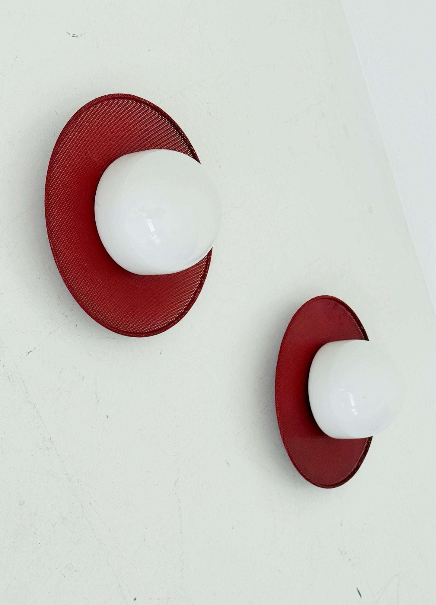Circular wall lights in micro-perforated metal and opal glass