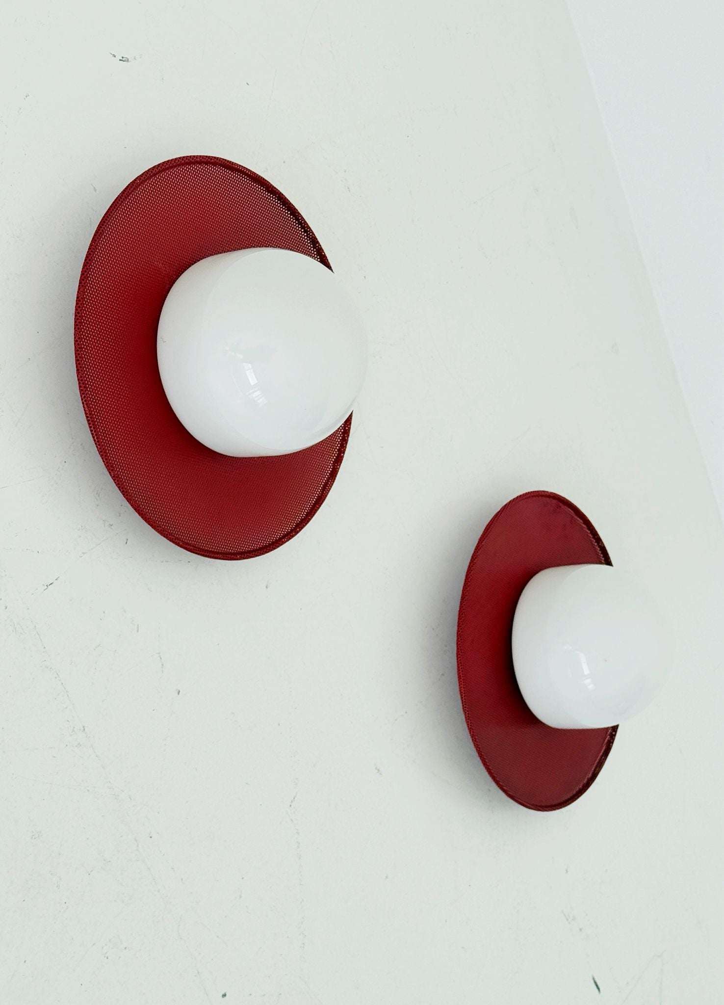 Circular wall lights in micro-perforated metal and opal glass
