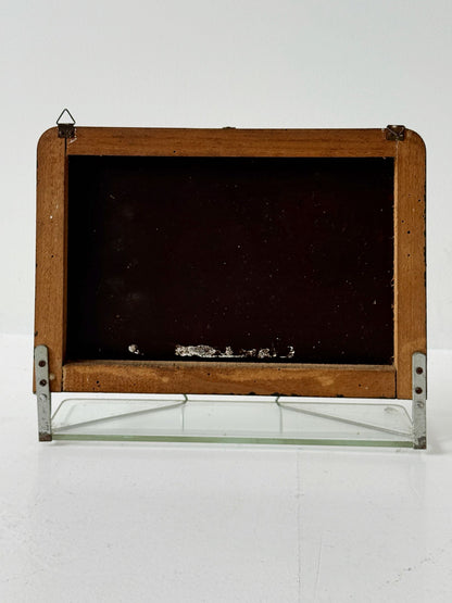 Small wall mirror with glass shelf