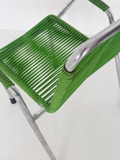 Small child's armchair in chrome-plated tubular metal and green cord — 1960s/70s