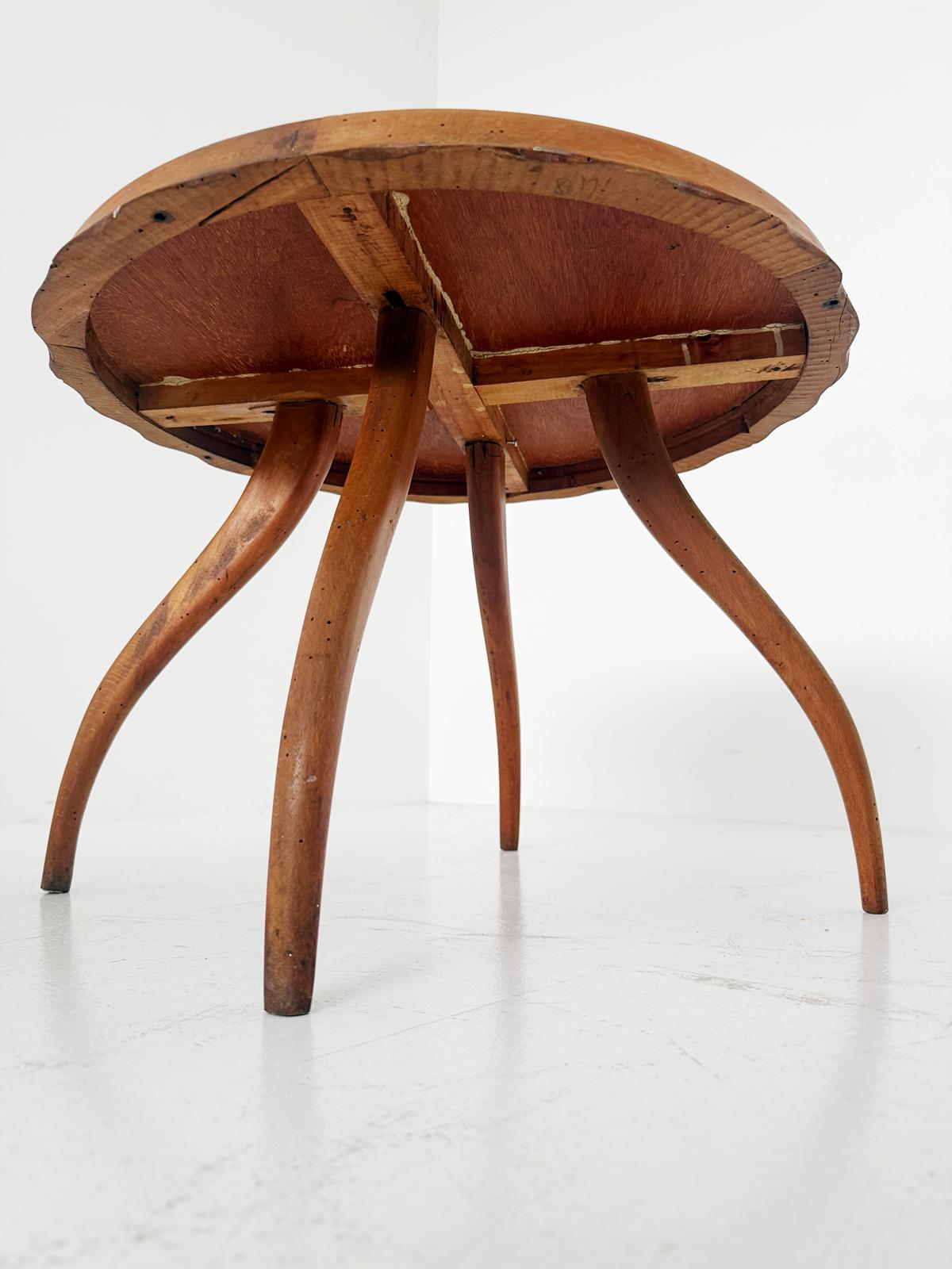 Round coffee table with glass top and wooden frame