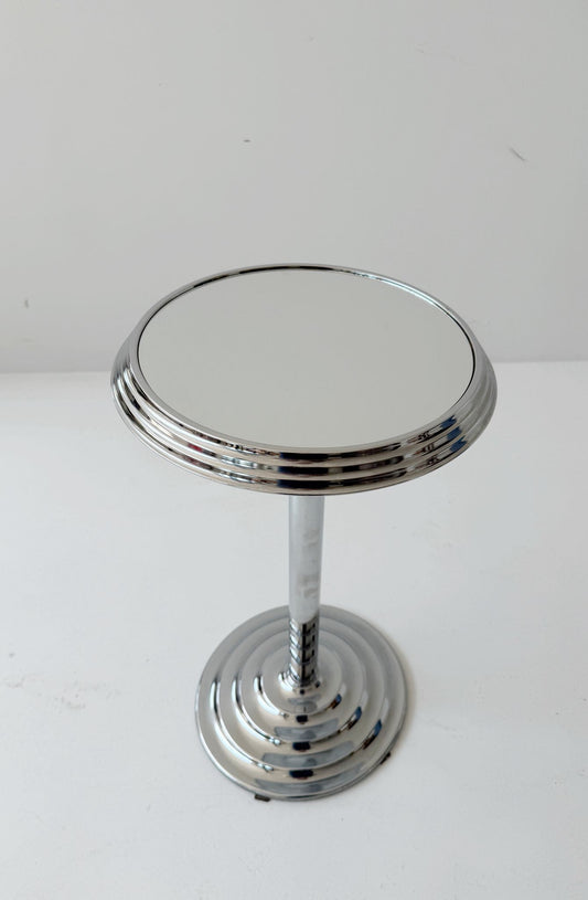 Chromed metal pedestal table with mirrored top