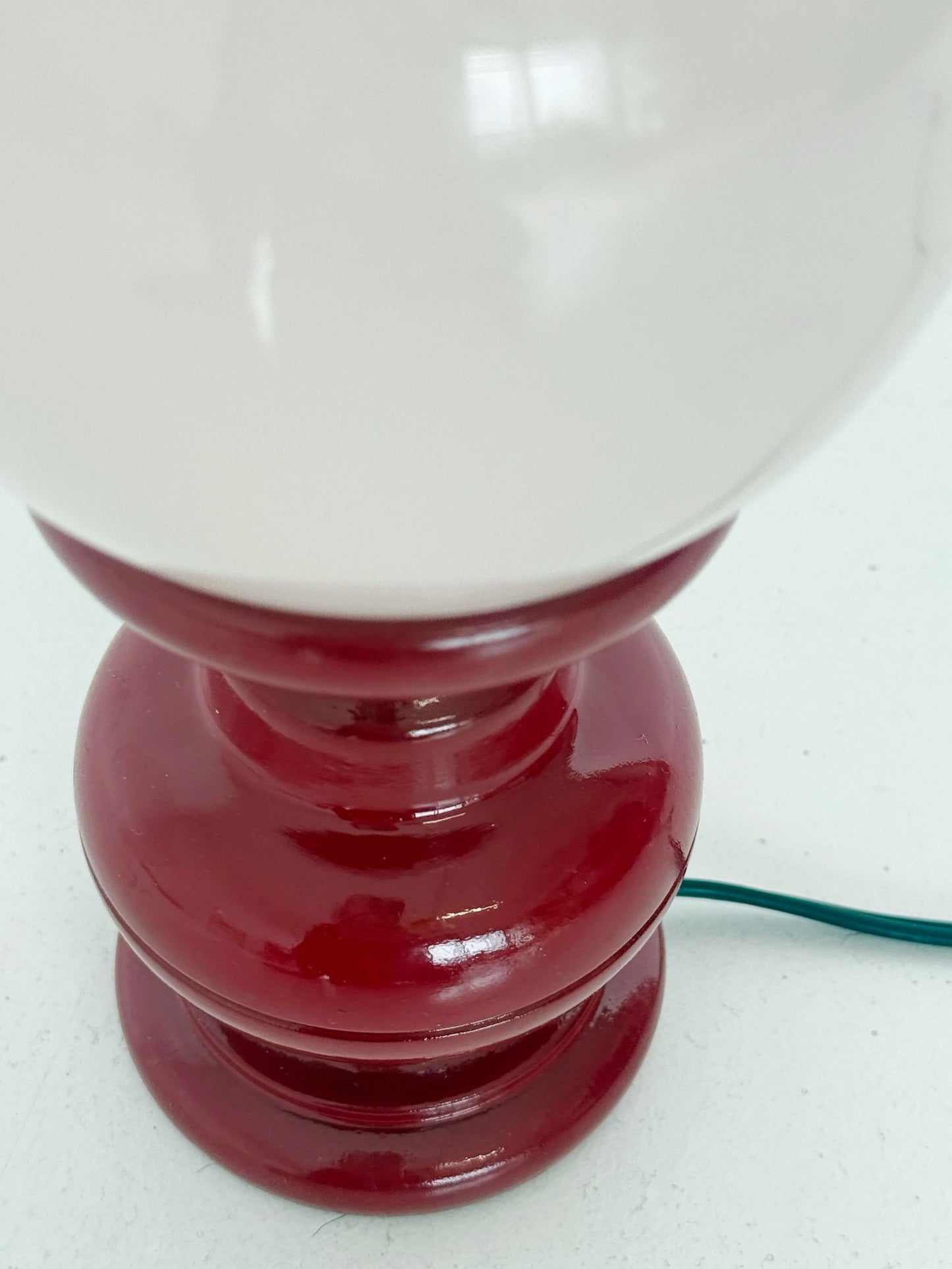 Red wooden table lamp with pink sphere