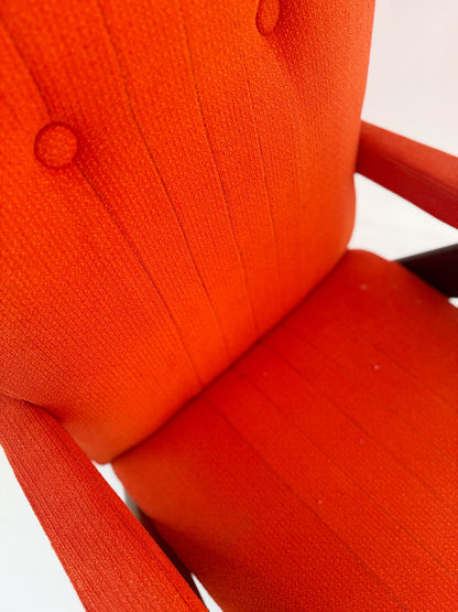 A pair of vintage reclining armchairs