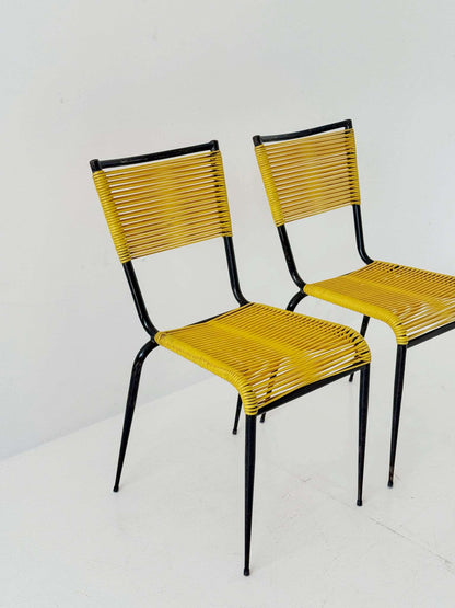 Pair of 1960s design chairs with metal frames and yellow woven detailing