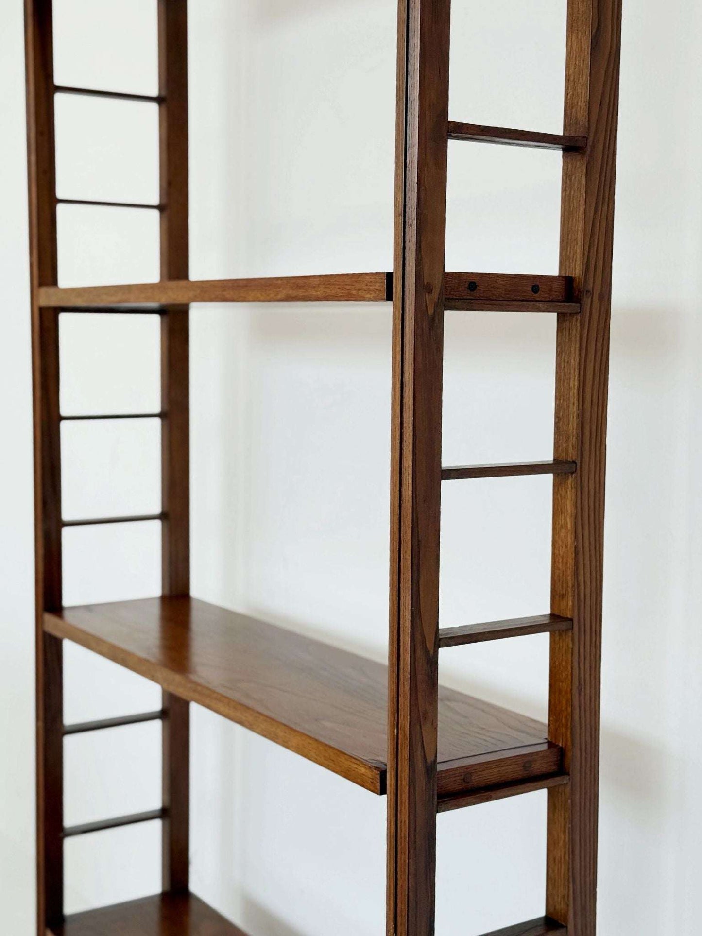Modular wooden bookcase with removable shelves Italy, 1960s–1970s