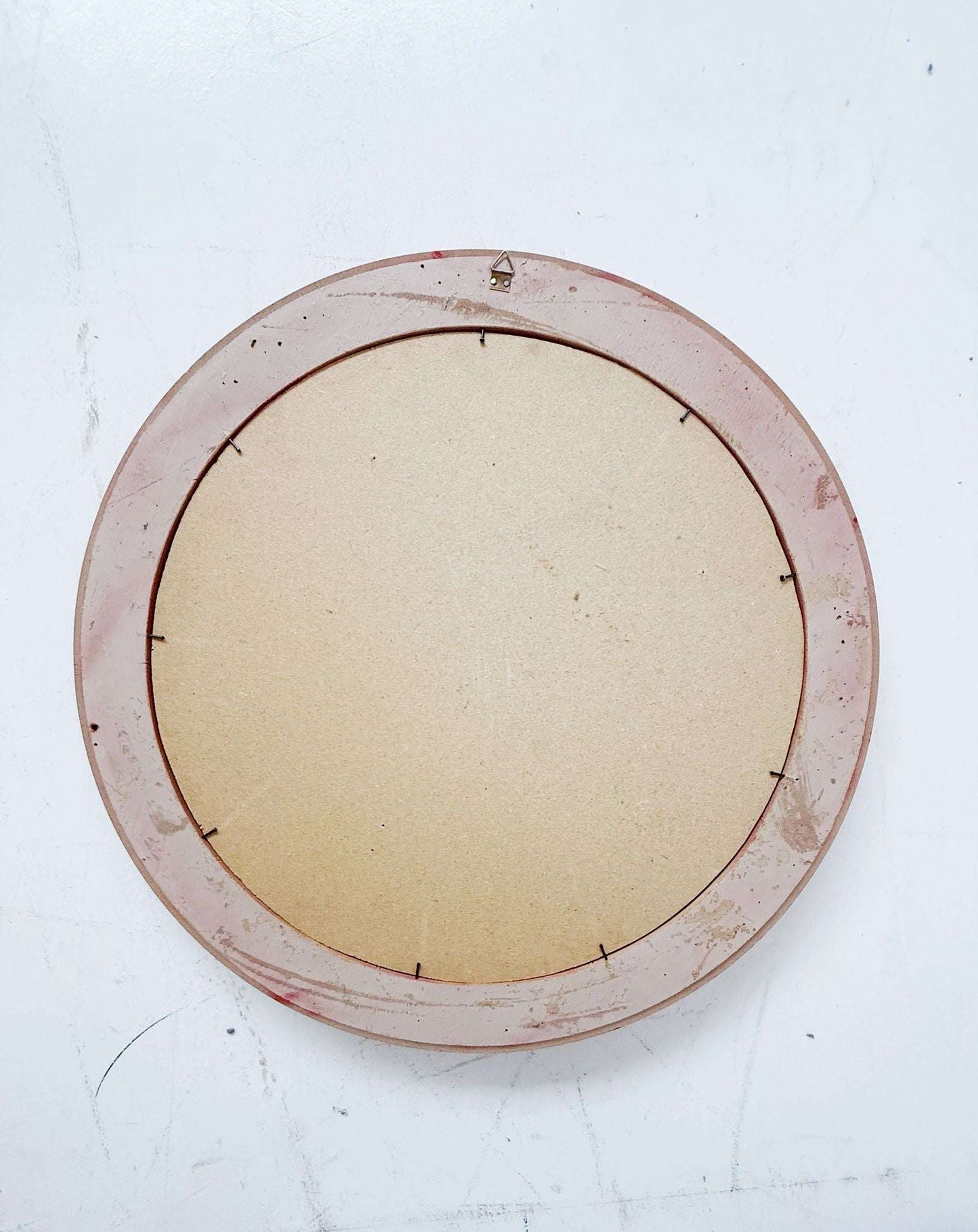 Round mirror with red lacquered frame