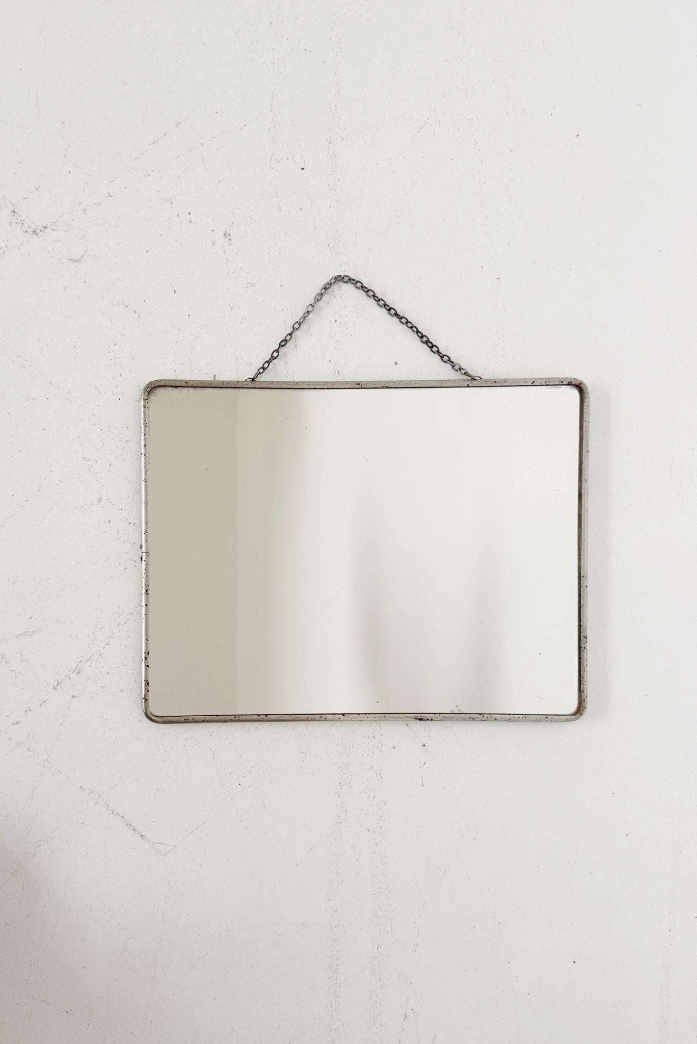 Rectangular mirror with metal frame