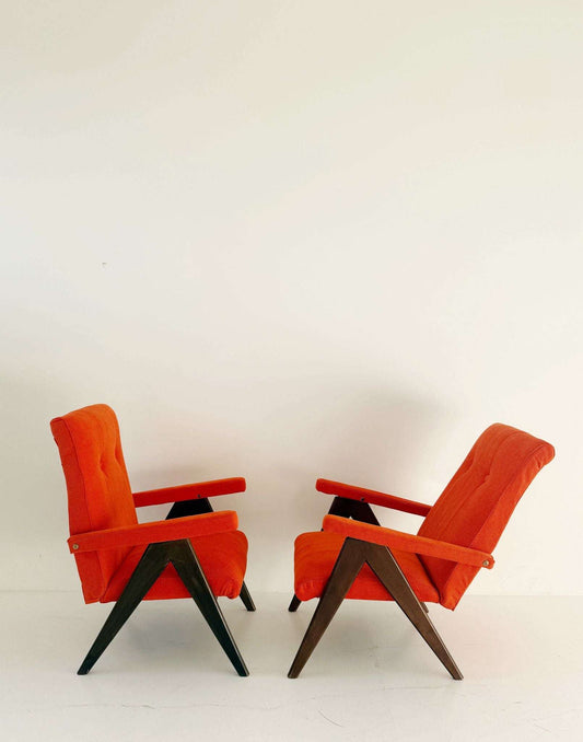 A pair of vintage reclining armchairs