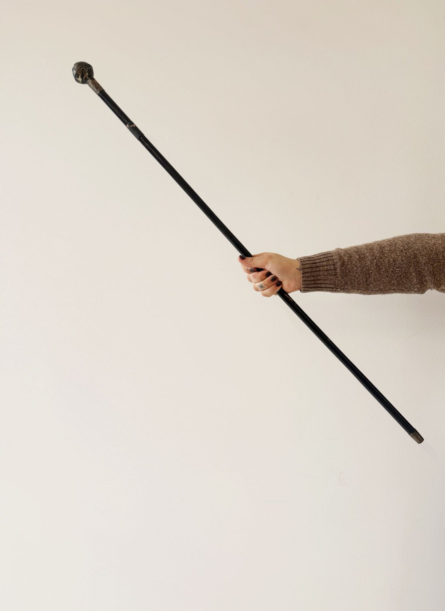 Cane with internal blade and military pommel, first half of the 20th century