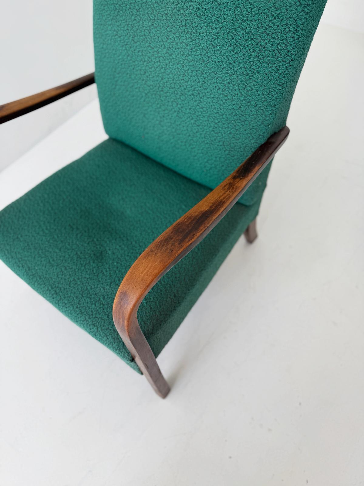 A pair of 1950s Italian armchairs featuring a simple and elegant line