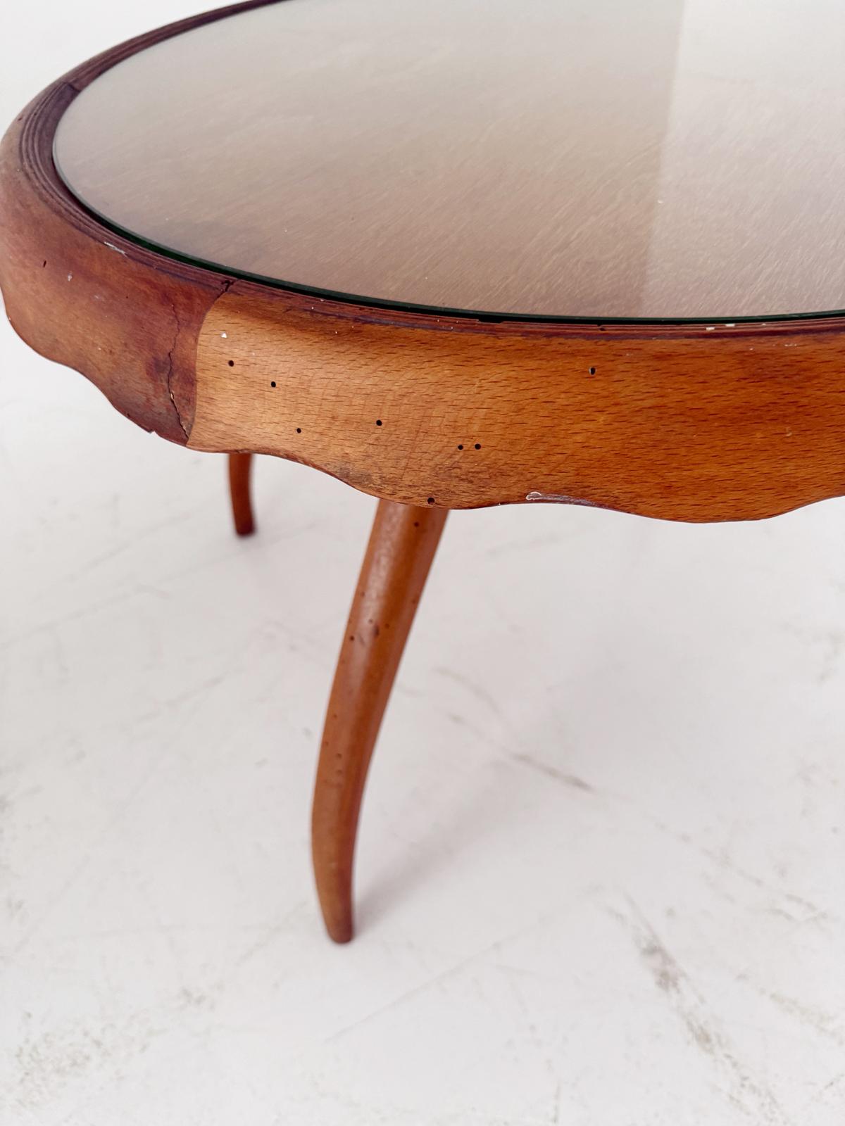 Round coffee table with glass top and wooden frame