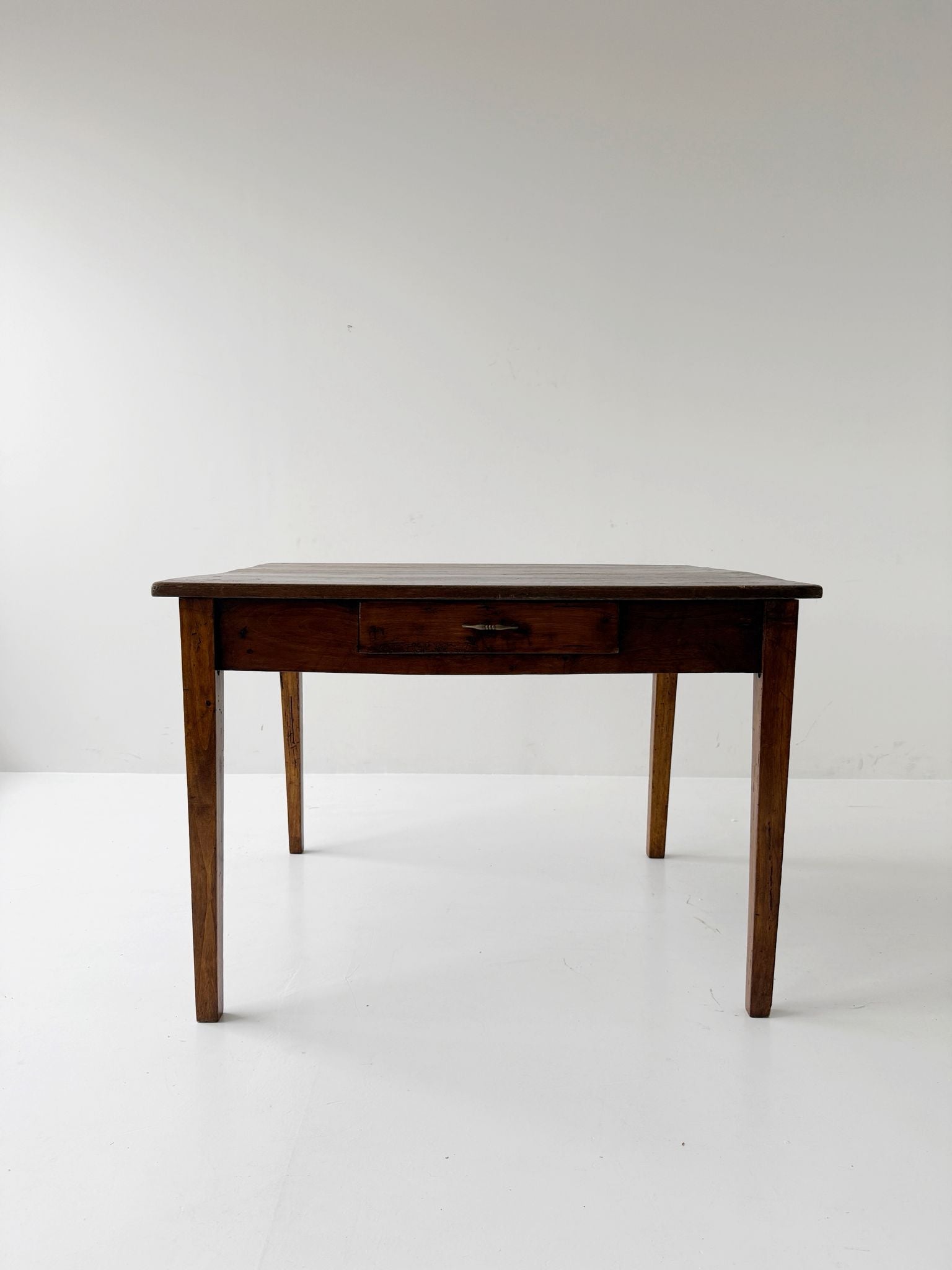 Directoire walnut table with central drawer, Italy, late 18th century