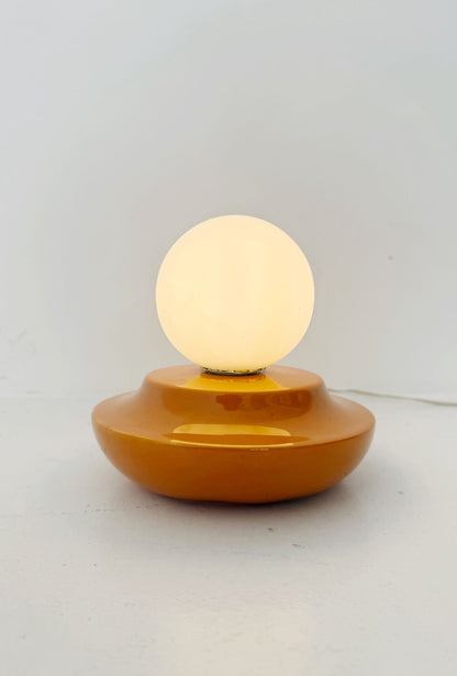 Orange glazed ceramic and opal glass table lamp