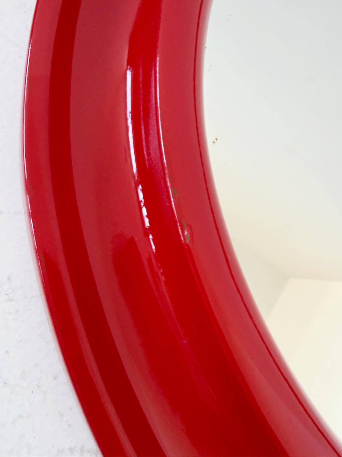 Round mirror with red plastic frame – Italy, 1970s/80s