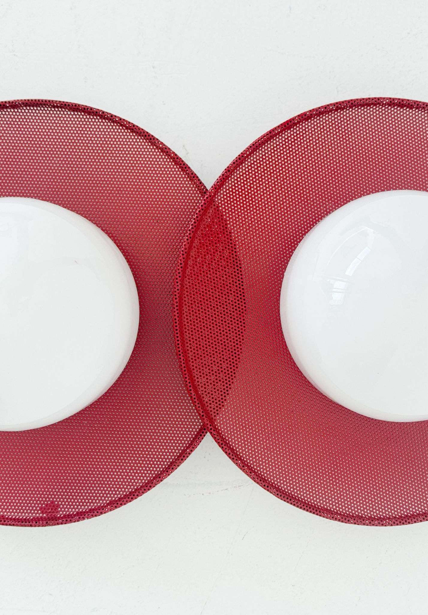 Circular wall lights in micro-perforated metal and opal glass