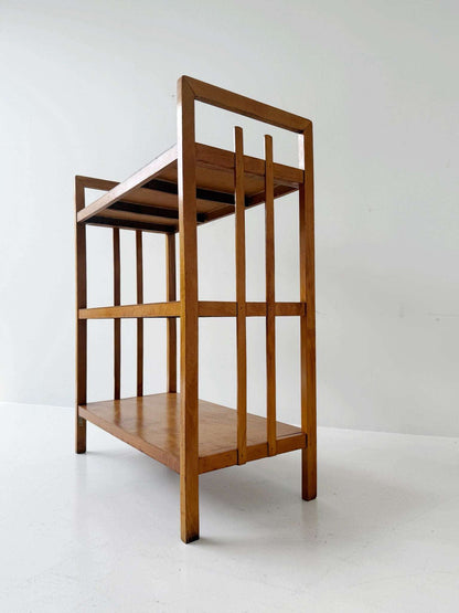 1960s bookcase features a wooden frame and a top shelf in white lacquered wood