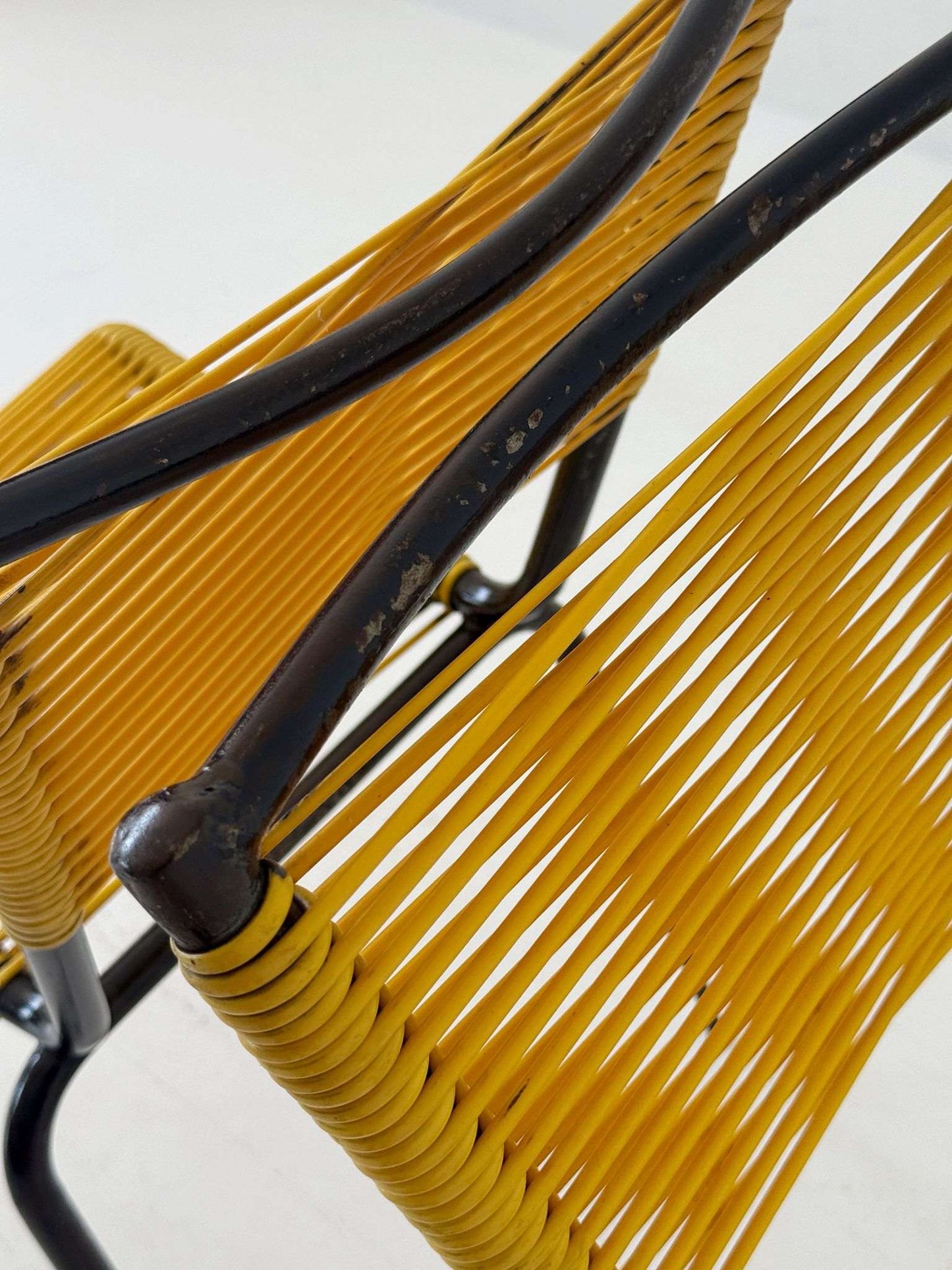 Pair of 1960s design chairs with metal frames and yellow woven detailing