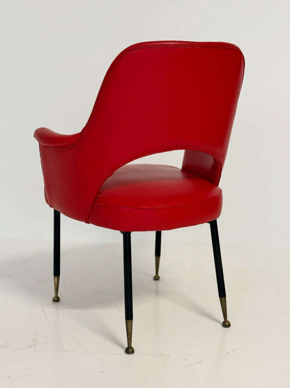 1950s Italian armchair in red vinyl, with a contoured back and open back.