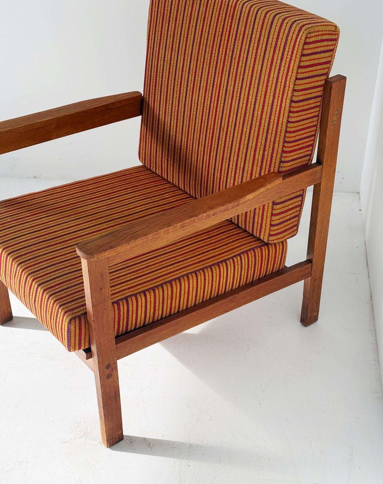 Solid wood armchair with striped upholstery