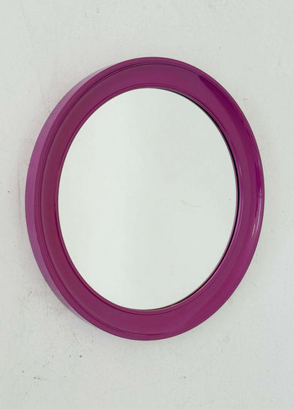 Round mirror with purple plastic frame