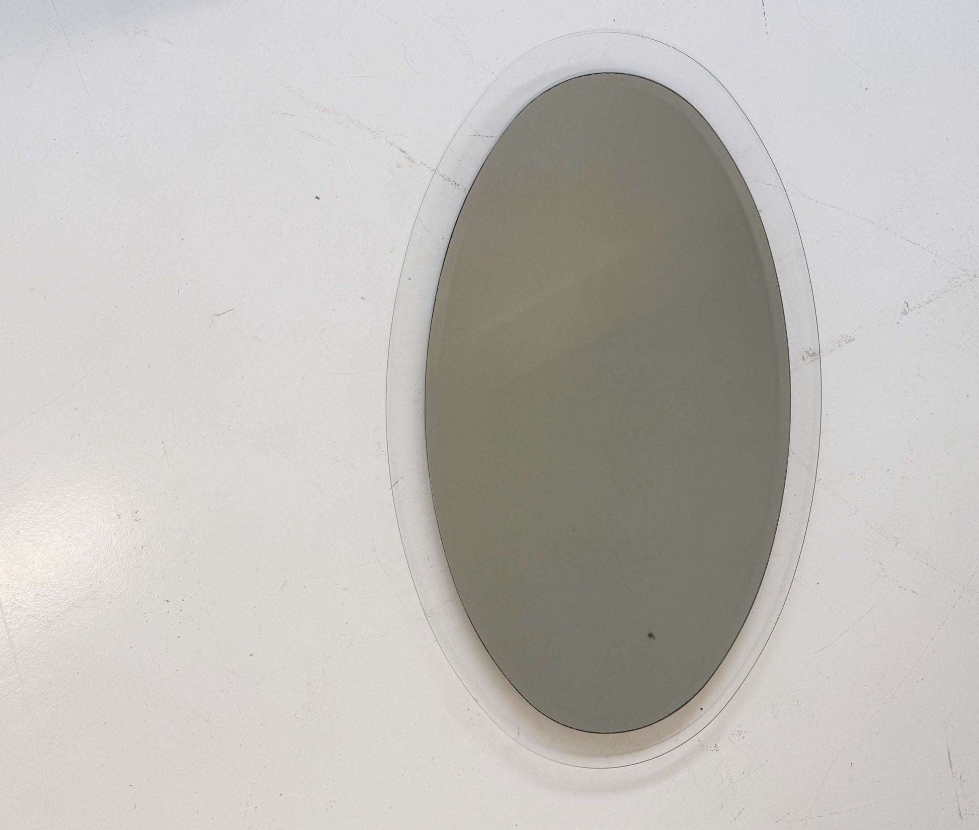 Oval mirror with clear glass frame (c. 1970s)