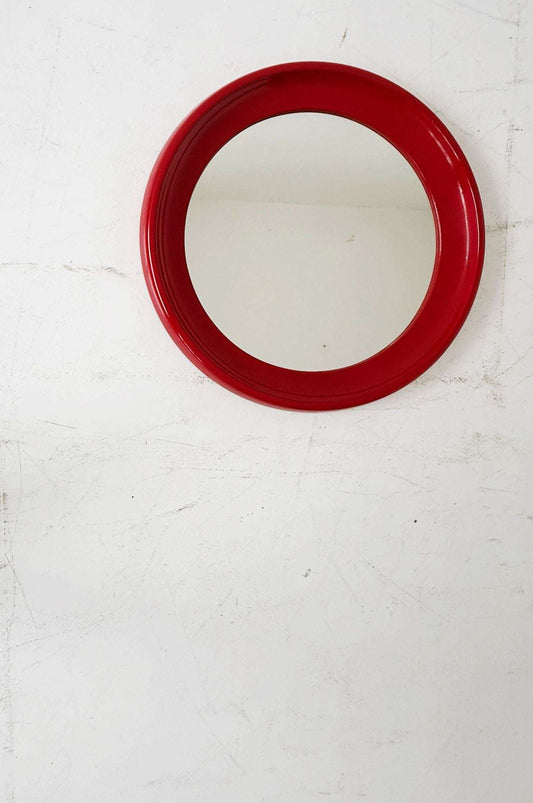 Round mirror with red lacquered frame