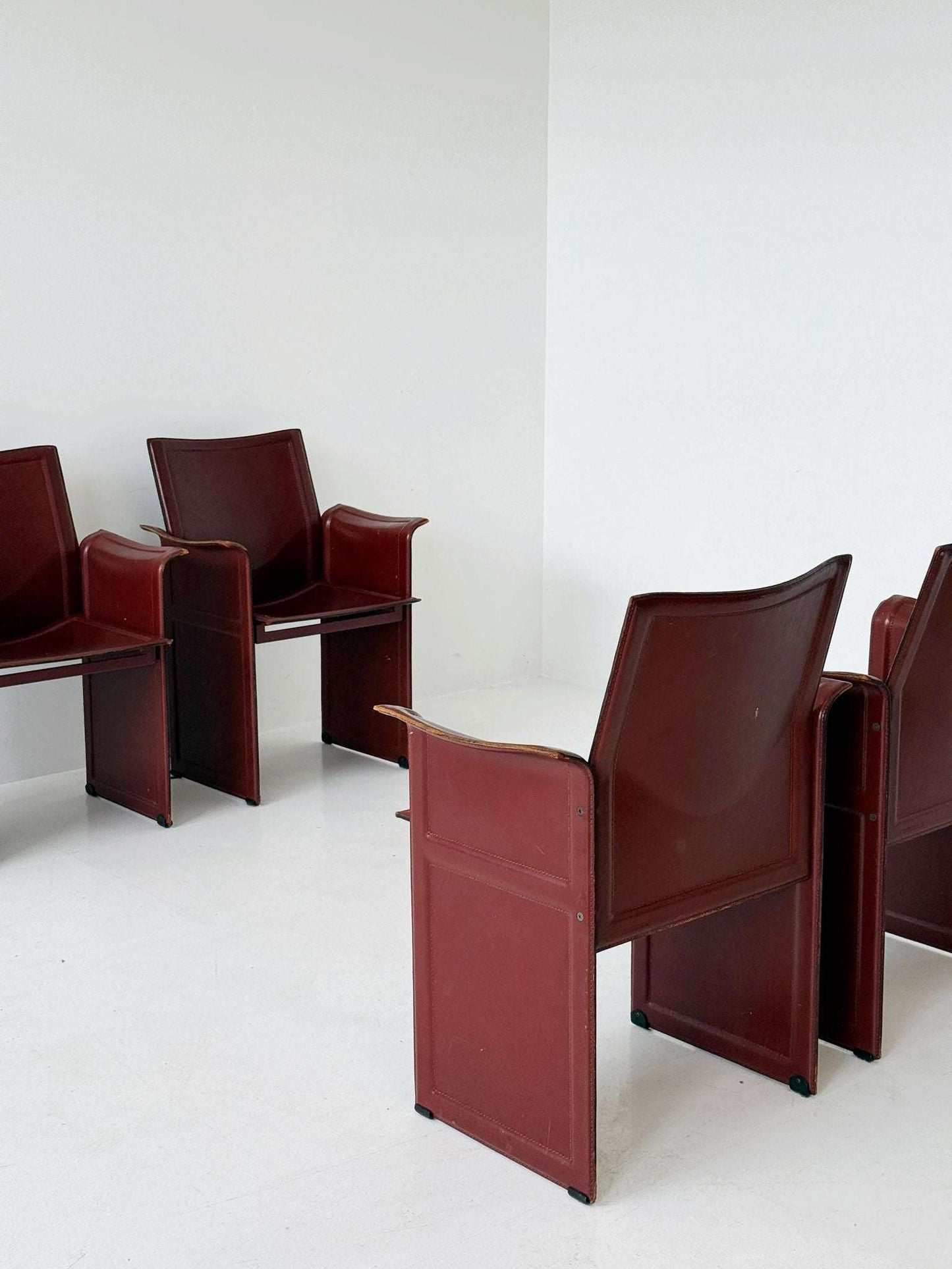 Set of four Matteo Grassi armchairs in burgundy leather, 1980s