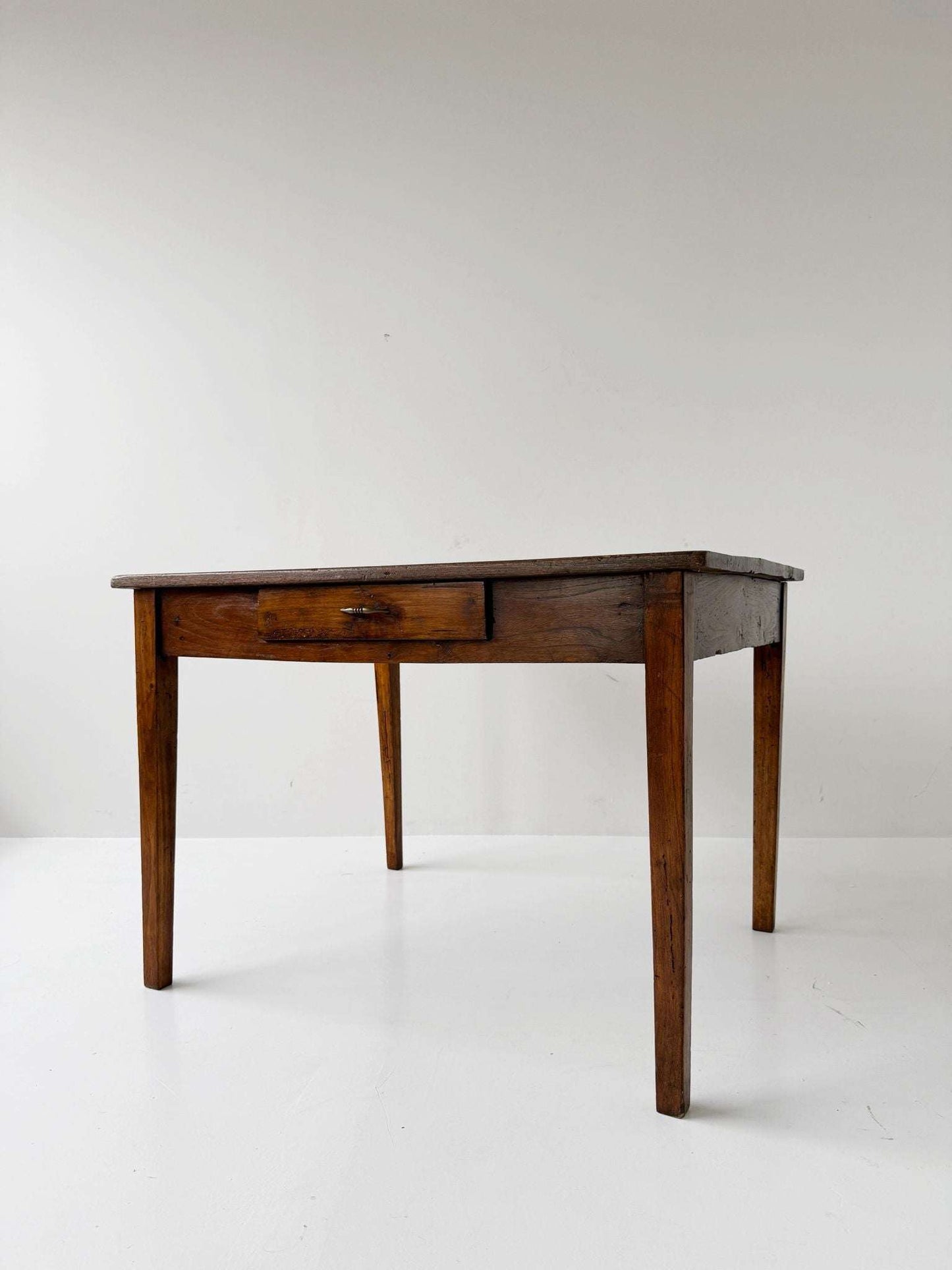 Directoire walnut table with central drawer, Italy, late 18th century