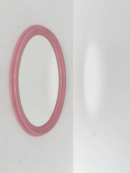 Oval mirror with a powder pink lacquered wooden frame