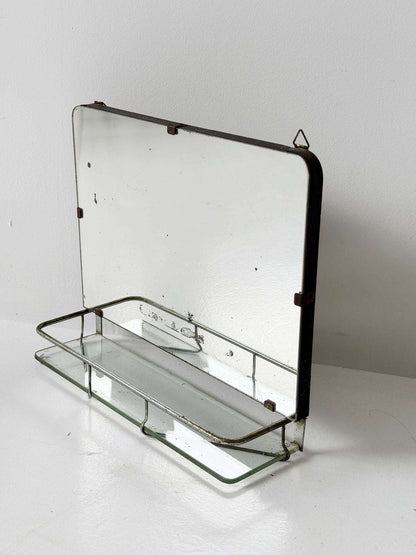 Small wall mirror with glass shelf