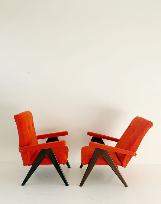 A pair of vintage reclining armchairs