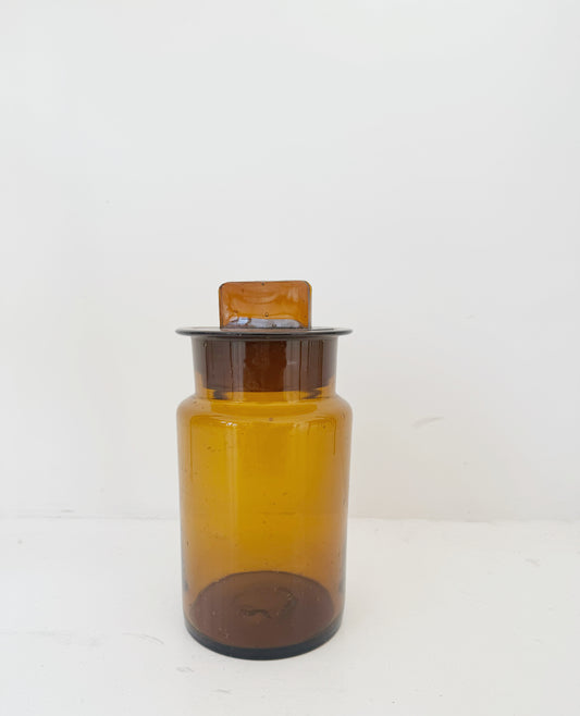 Vintage amber glass apothecary jar with cap