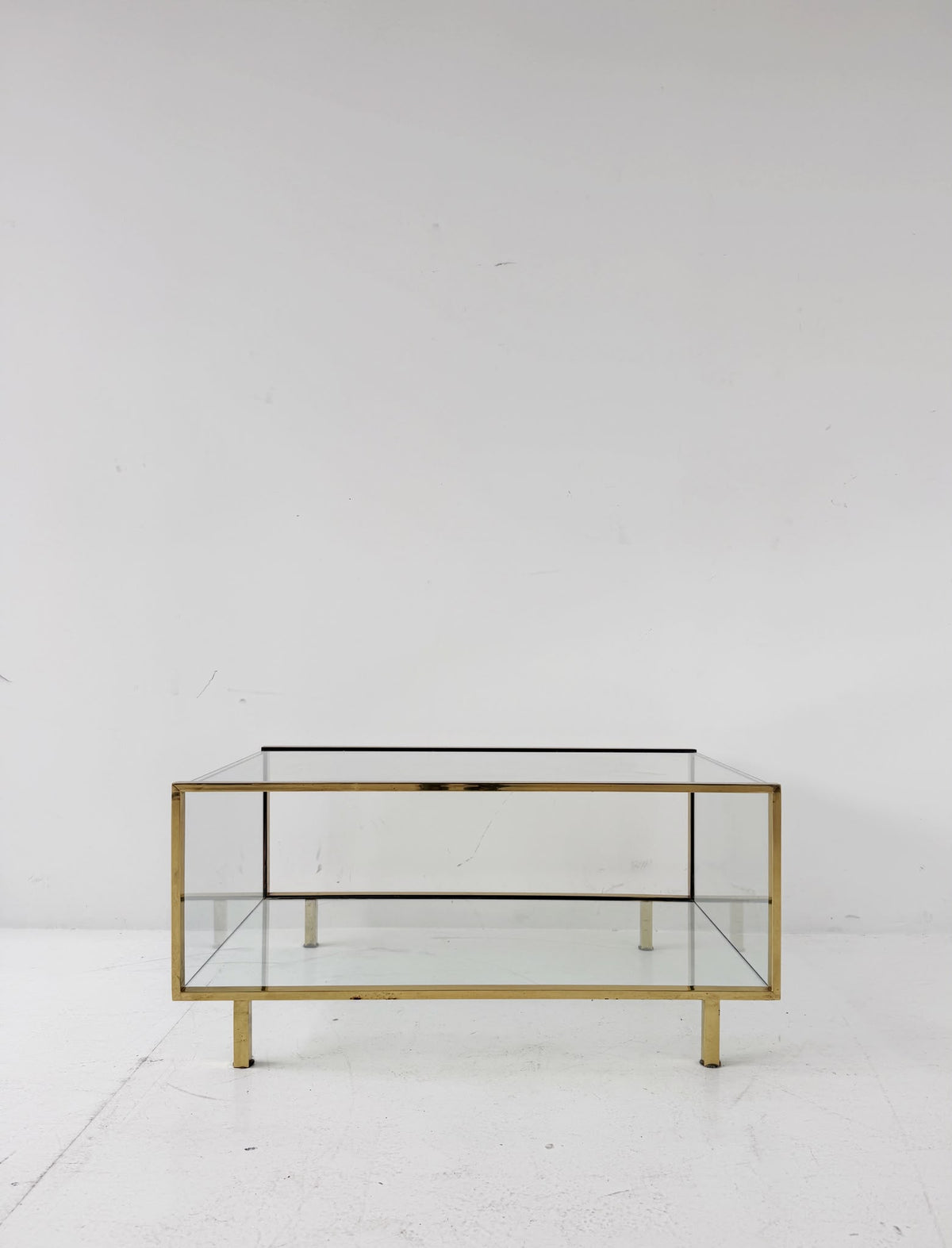 Gold-tone metal and glass coffee table, 1970s.