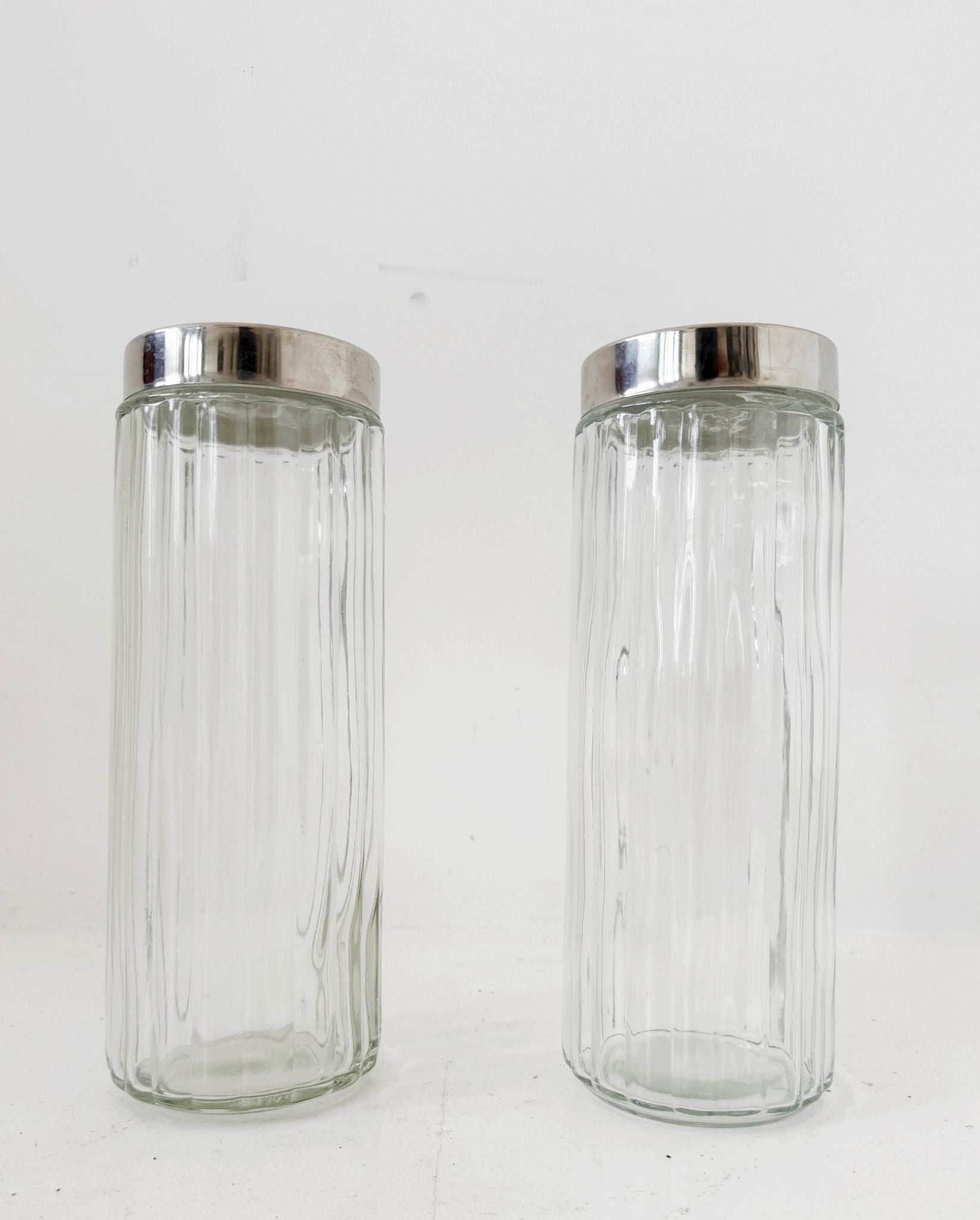 Pair of blown glass jars with metal lids, 1960s–1970s