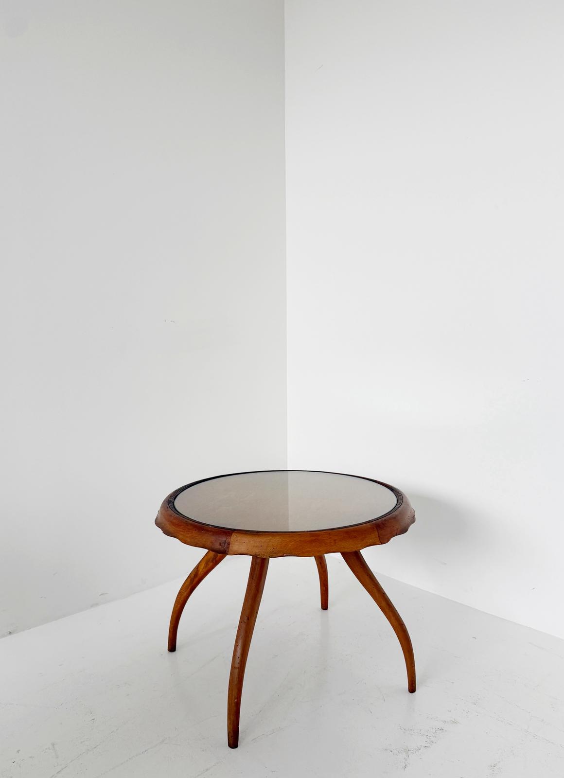 Round coffee table with glass top and wooden frame