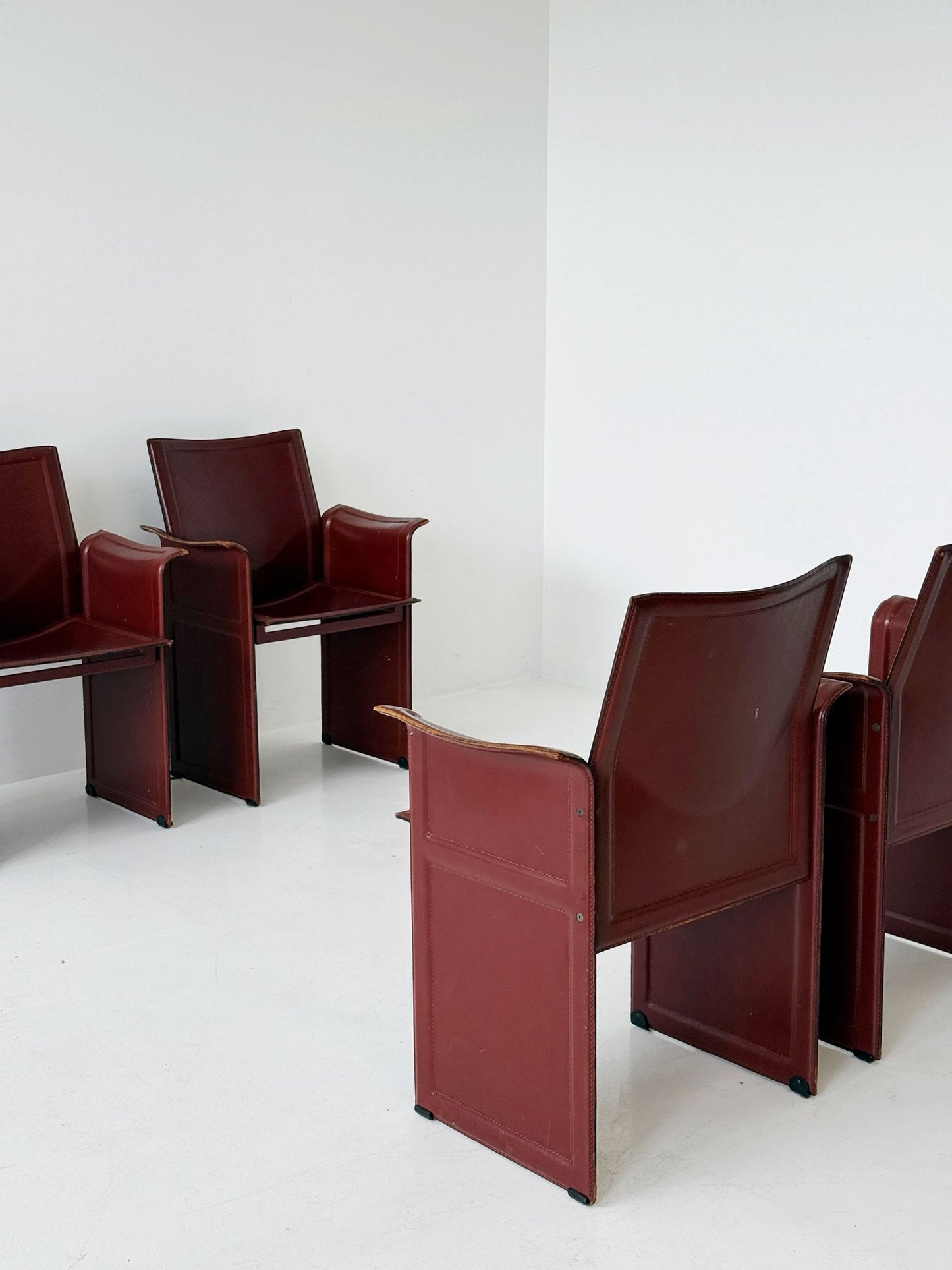 Set of four Matteo Grassi armchairs in burgundy leather, 1980s