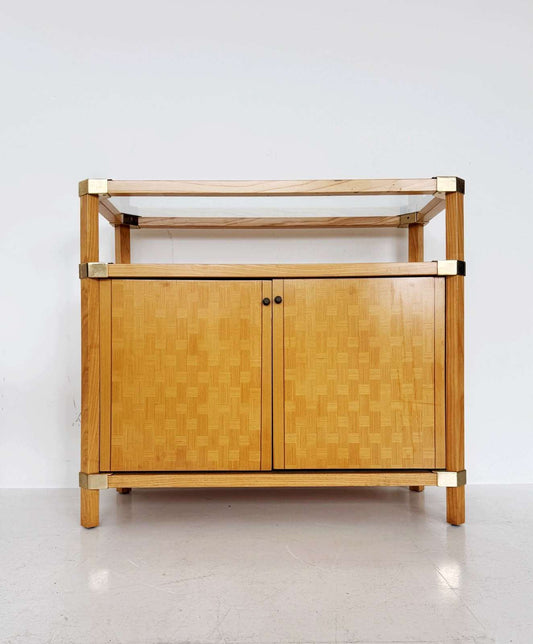 Wooden storage unit with a glass top and gold-tone metal details, 1970s–80s.