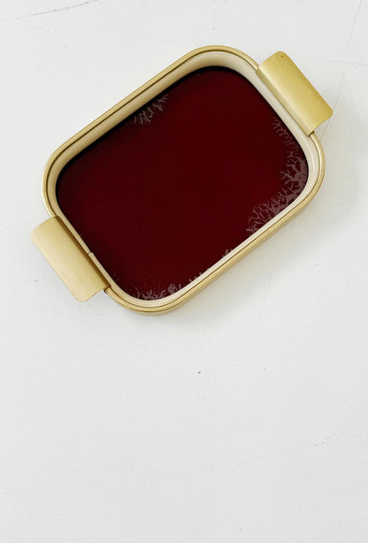 Vassoio in metallo dorato e vetro bordeaux, anni ’50-’60
