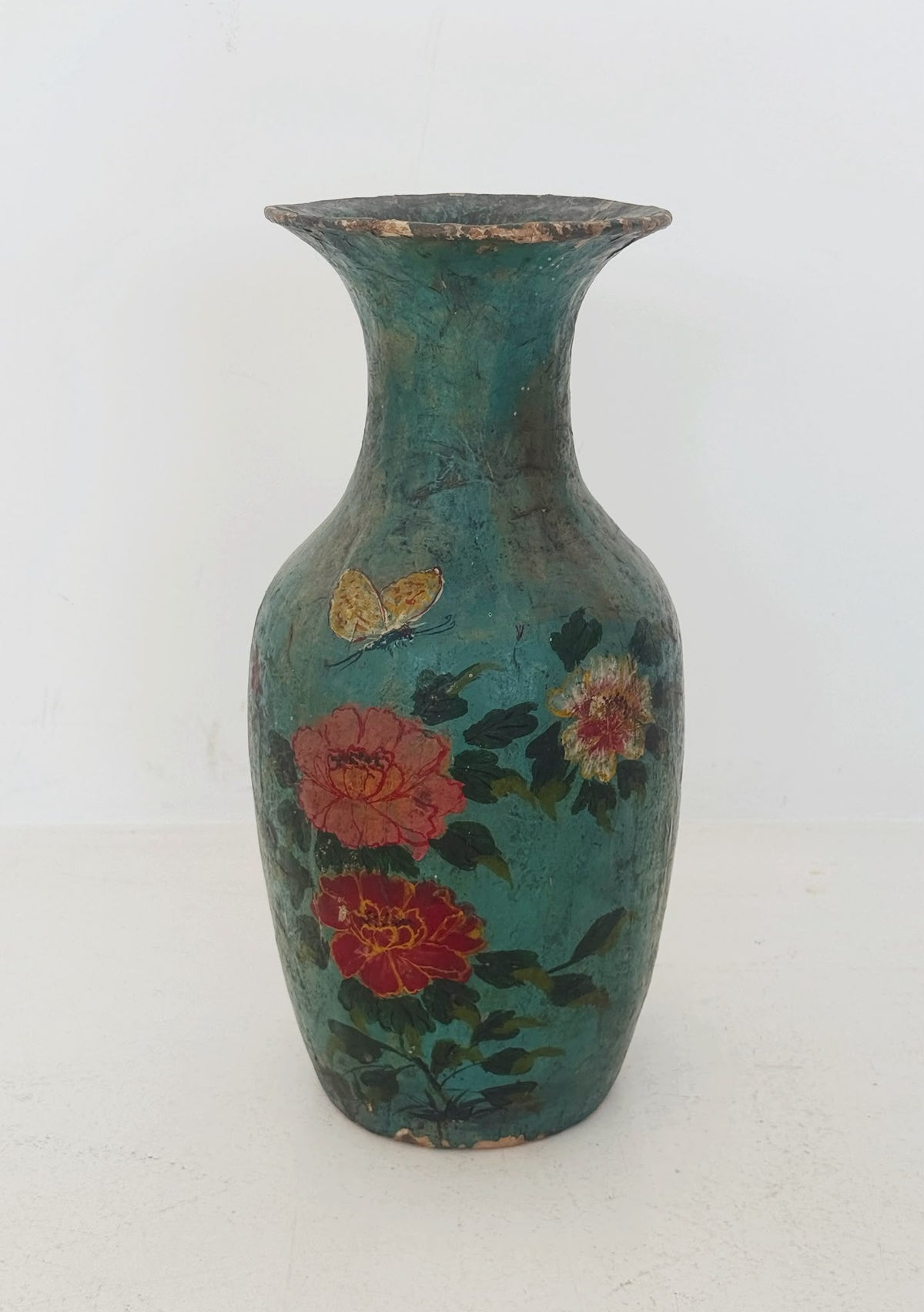 Turquoise papier-mâché vase with butterfly