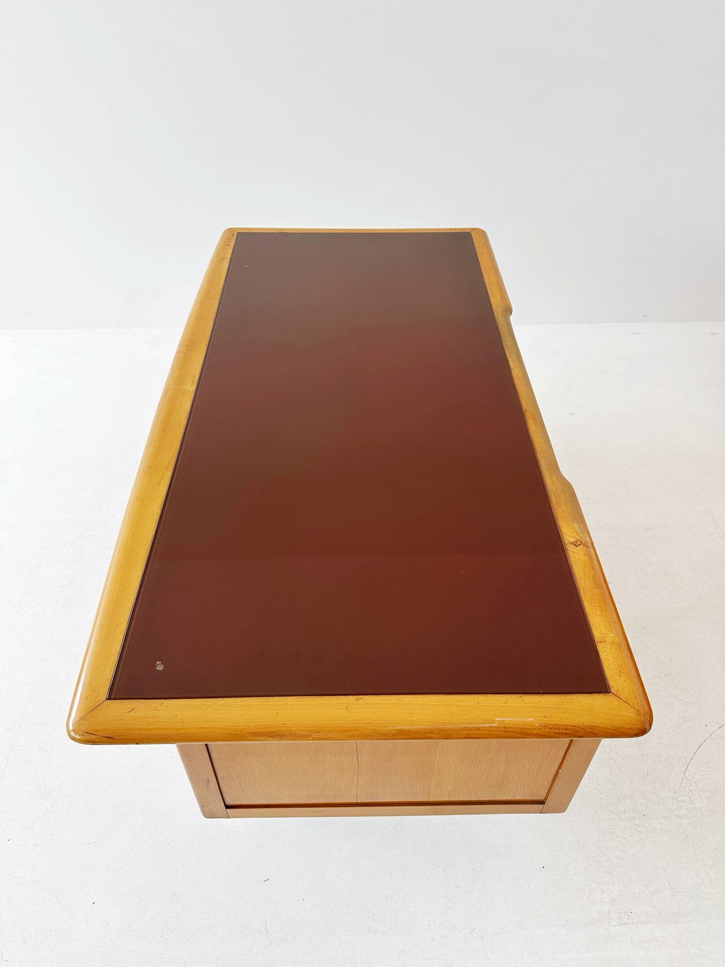 Desk with brown glass top