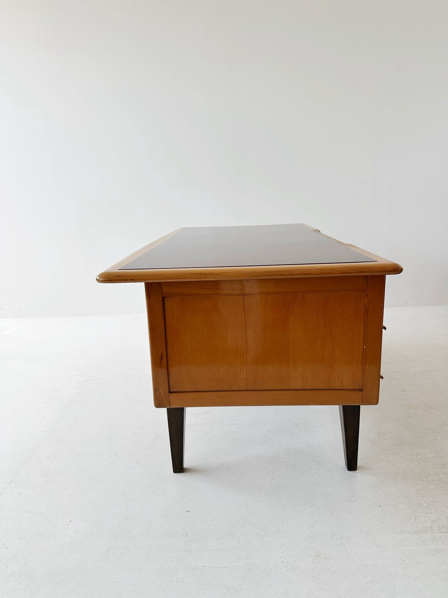 Desk with brown glass top