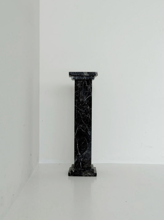 Black veined marble backsplash