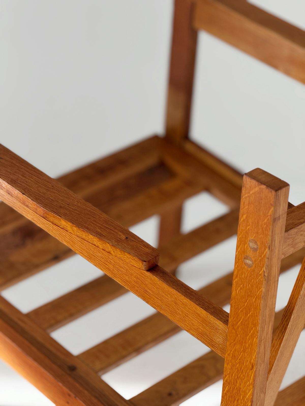 Solid wood armchair with striped upholstery