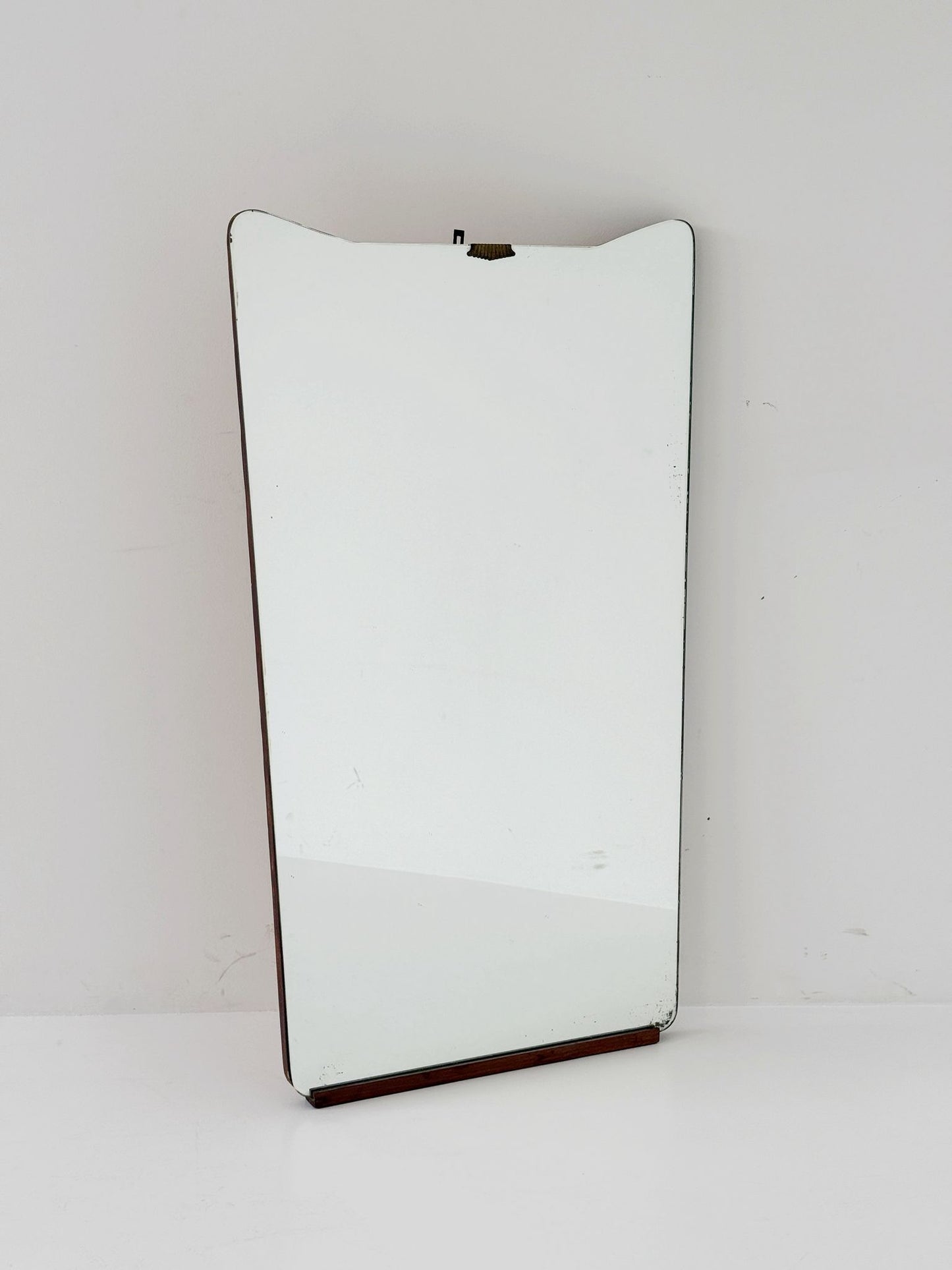 Shaped wall mirror with wooden edge