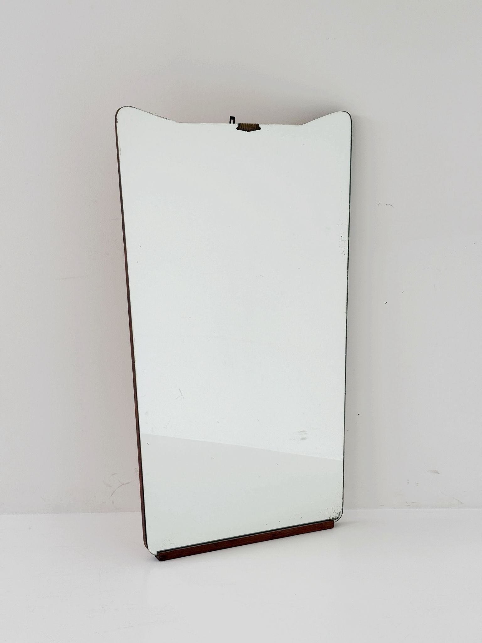 Shaped wall mirror with wooden edge