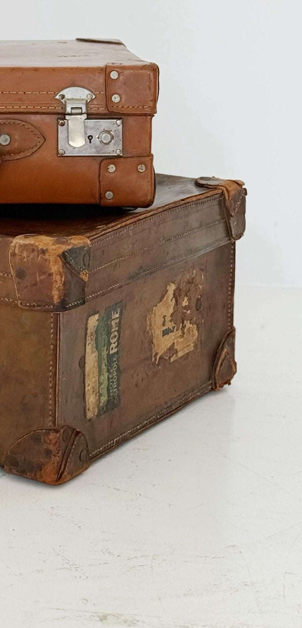 Leather travel suitcase with hotel labels